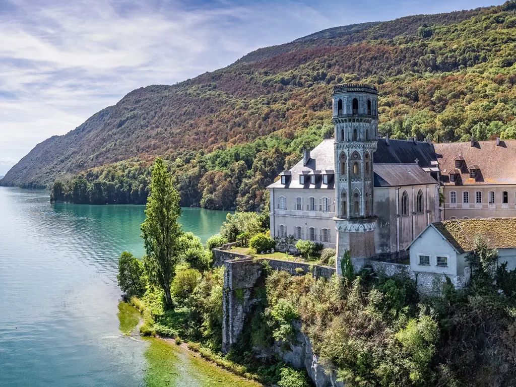 Rustic, church-like building elevated in the middle of the ocean