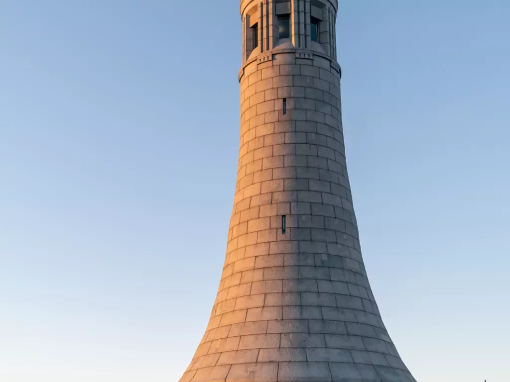 Sunset hitting a stone lighthouse