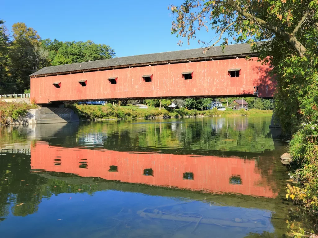 Red bridge over a river