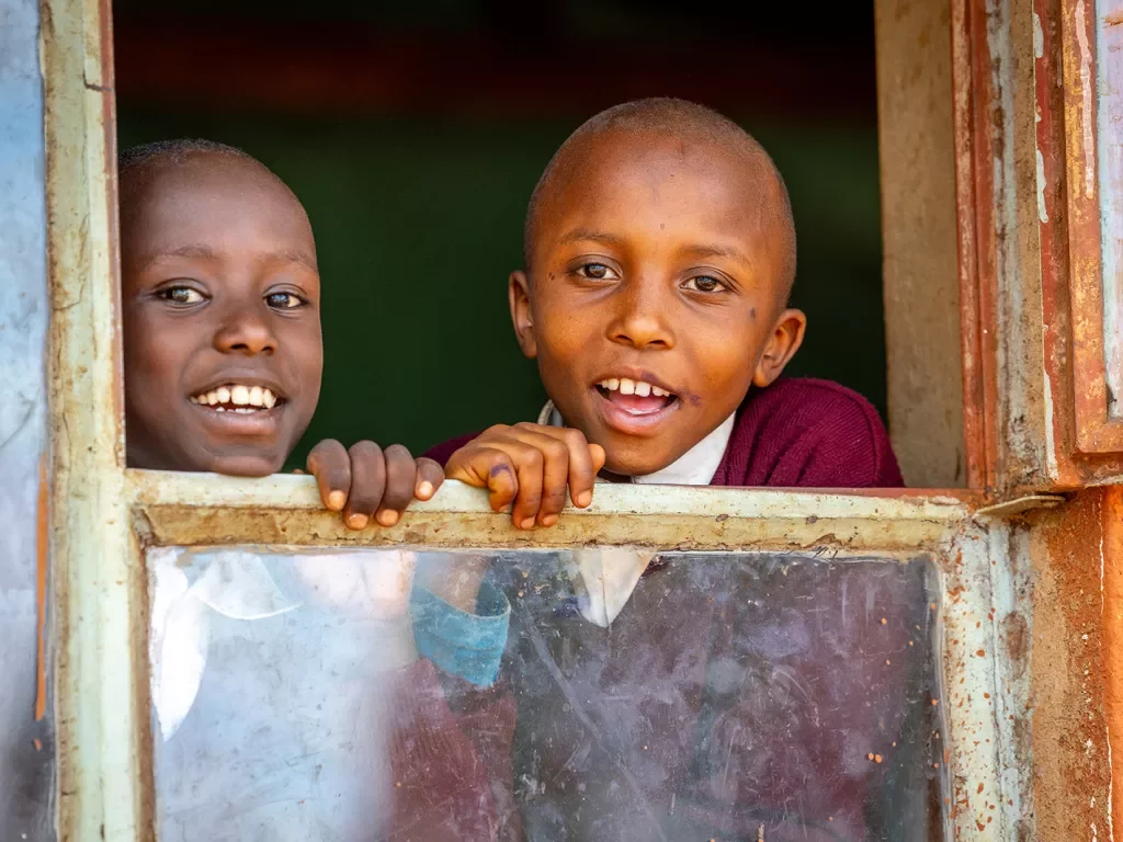 children looking out a window