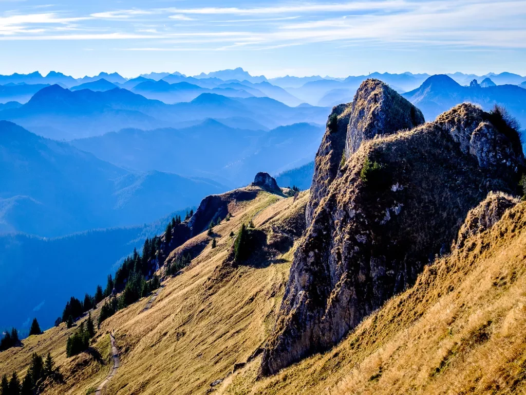 Rocky hill with large mountains in the distance