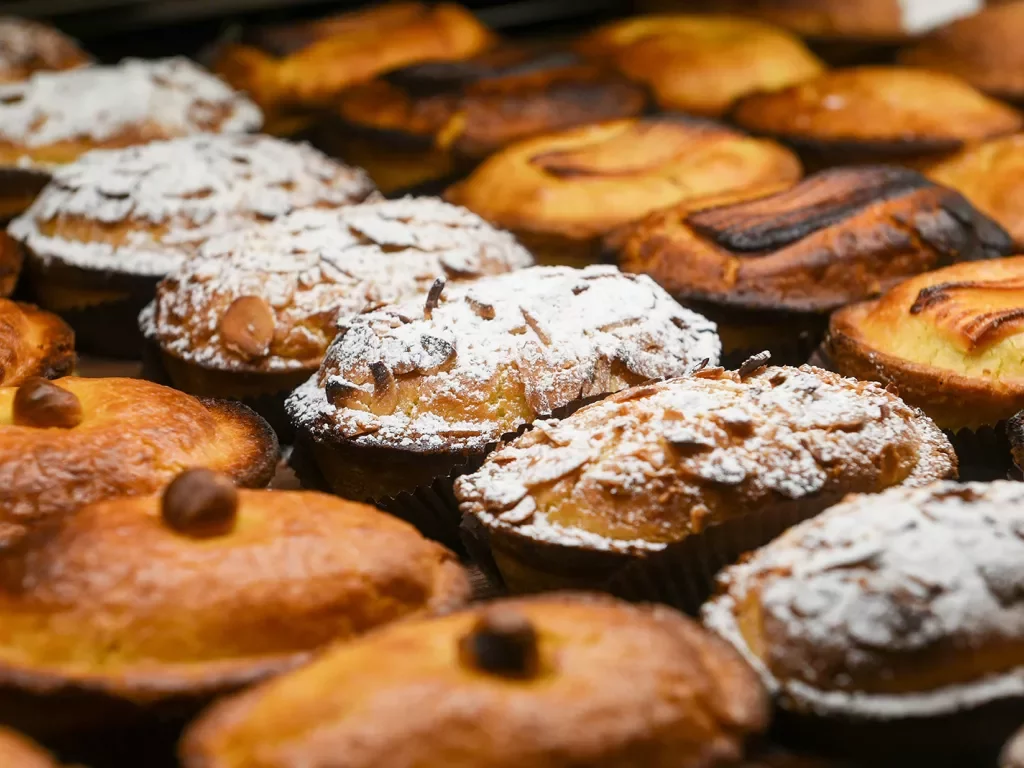 Pastries lined up covered with powdered sugar