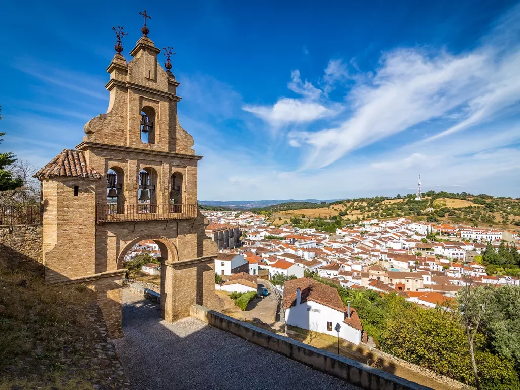 Rustic bell tower overlooking a small town