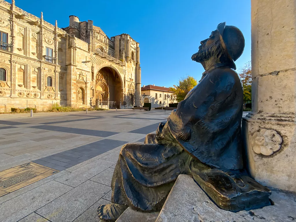 Bronze statue in an open courtyard in a rustic, Spanish center