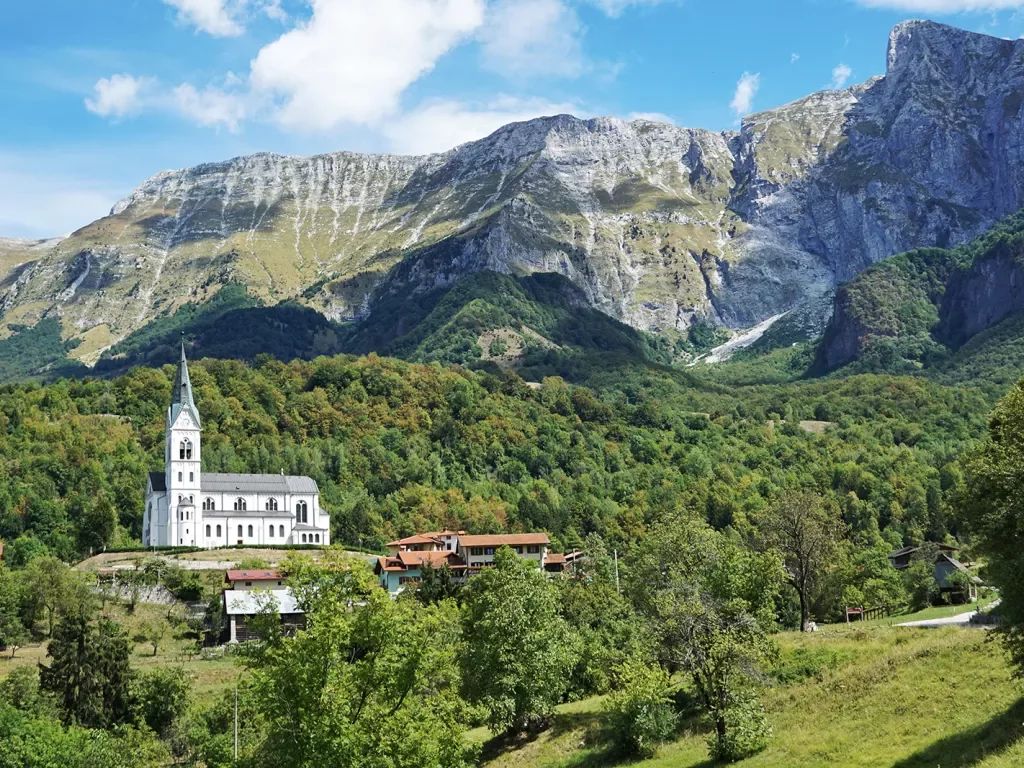 a church in front of a large mountain