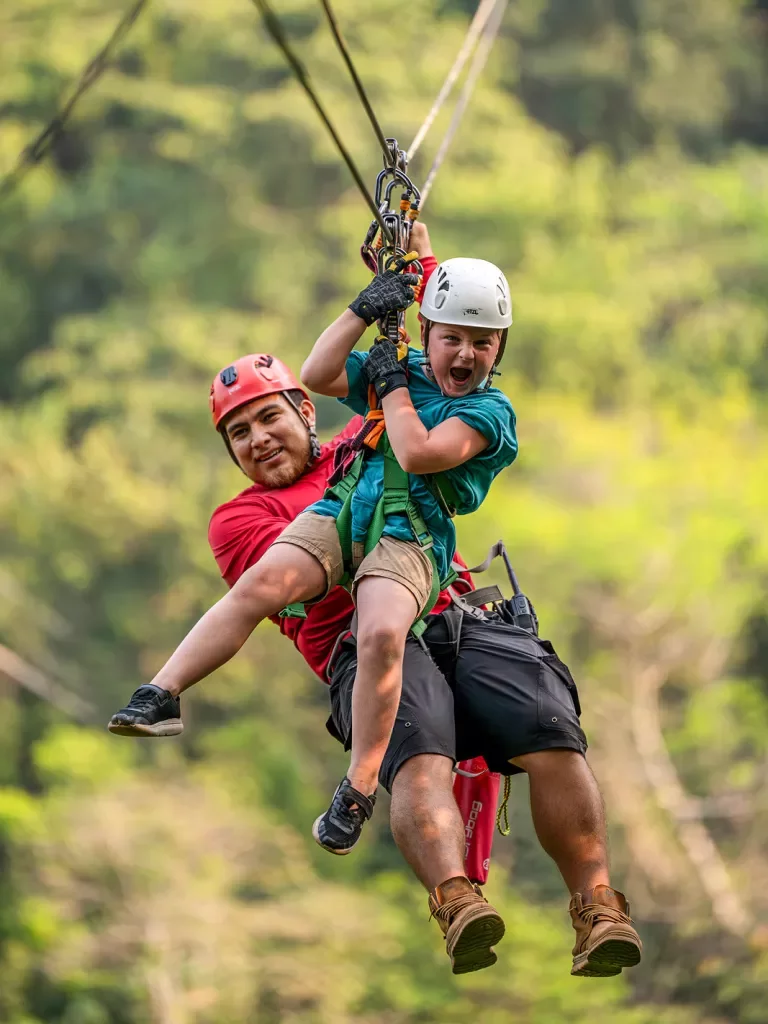 Father and son on a zipline