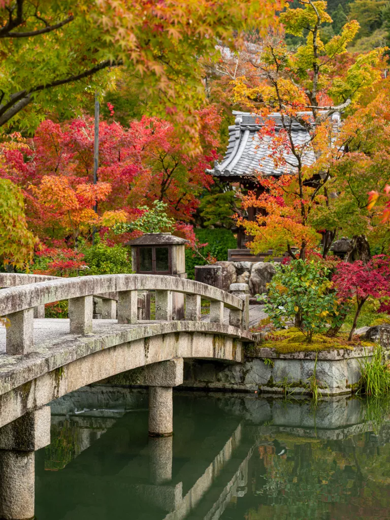 Concrete bridge leading towards a Japanese shrine